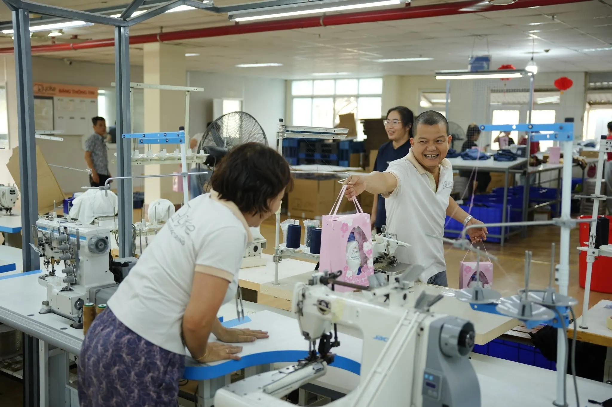 Yoke team members sharing gifts on the factory floor