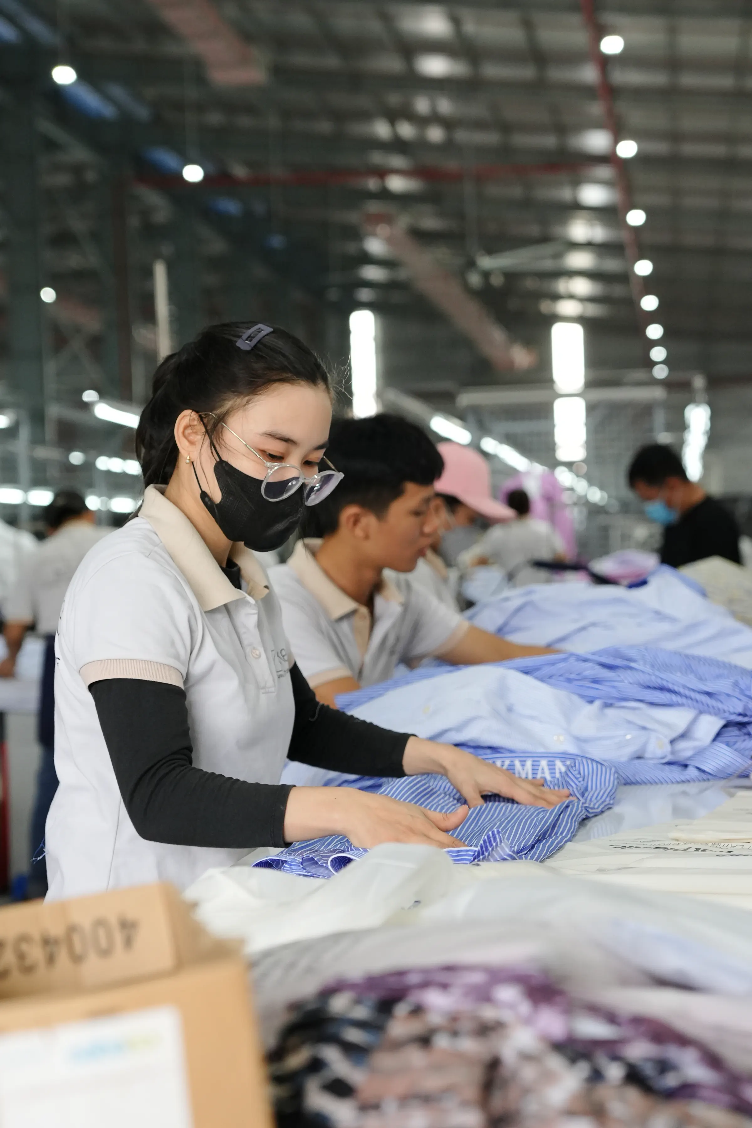 Yoke team members checking finished shirts