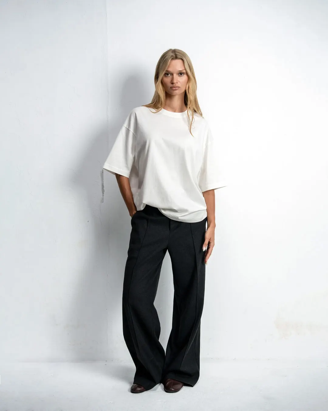 Model wearing a white Yoke Apparel blank T-shirt