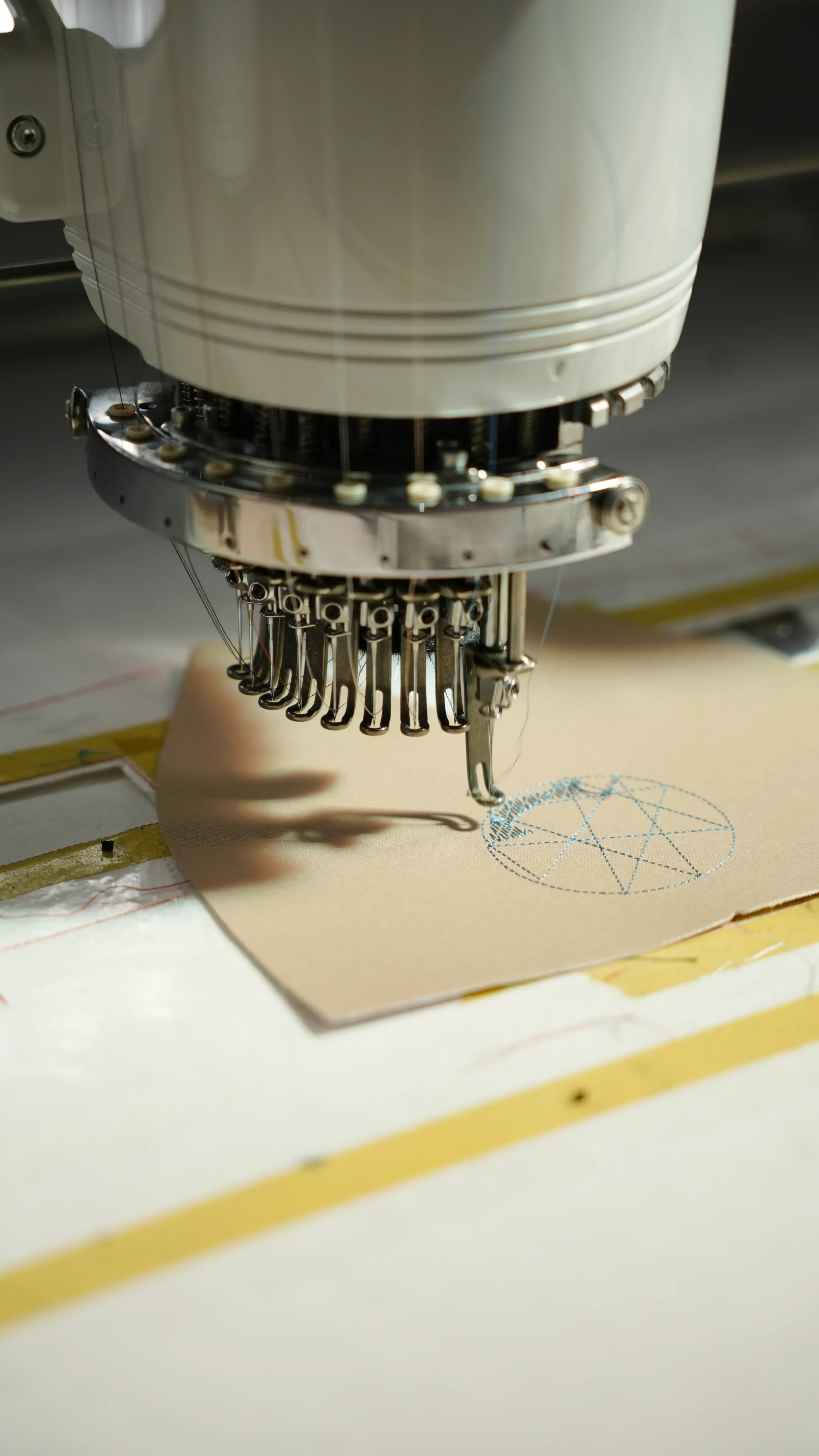 Embroidery machine stitching a design onto fabric